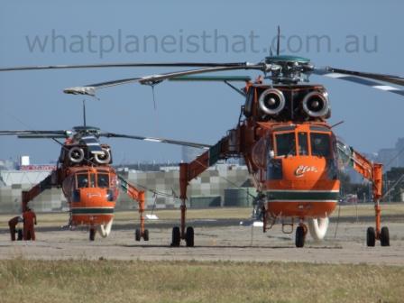 Two Erickson Air-Cranes wait on the tarmac at Essendon Airport for their next deployment